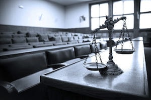 Law Scale of Justice on a Court Room